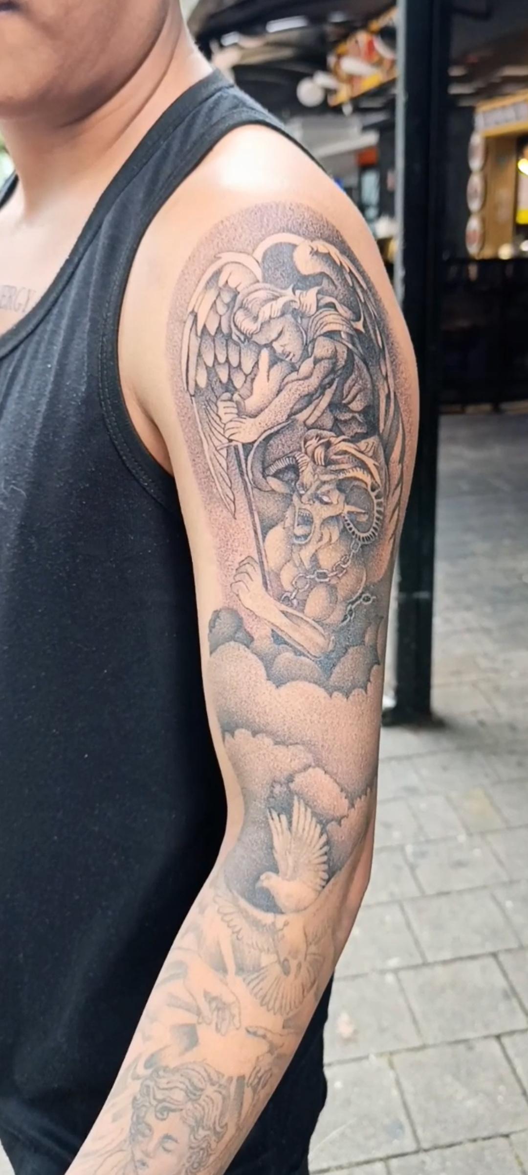Black and grey realism sleeve tattoo